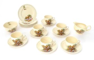 A quantity of Crown Ducal tea wares decorated with a Hovis cottage and garden to include milk jug,