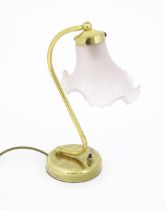 A late 20thC table lamp with pink shade, approx 13 1/2" tall Please Note - we do not make