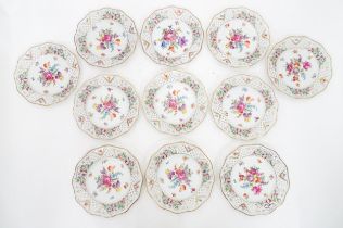 Eleven Royal Dresdner Art dessert plates with floral detail and pierced borders. (11) Please