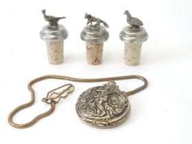 Three bottle stoppers surmounted by models of pheasant, partridge and fox, together with a pocket