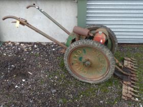 A mid 20thC Allen Scythe reciprocal mower, with Villiers engine, serial number 824310. Approx 82"