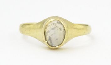 A 9ct gold ring set with central moonstone. Ring size approx. M Please Note - we do not make