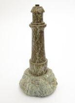 A table lamp formed from serpentine modelled as a lighthouse. Approx. 11 3/4" high Please Note -