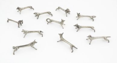 A quantity of 20thC Continental novelty knife rests modelled as animals to include ram, pig, bear,