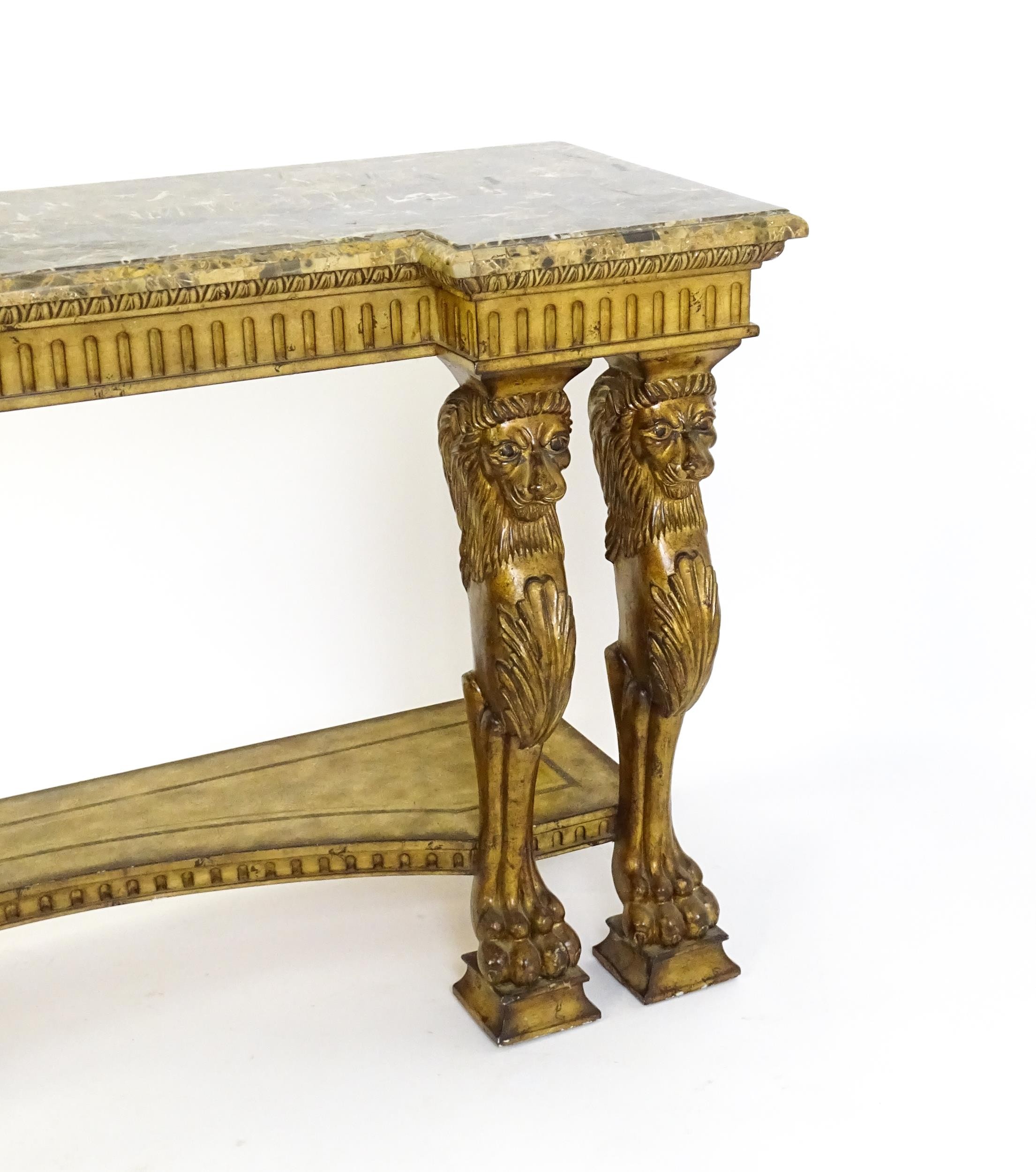 A late 20thC marble and wooden topped inverted break front console table with two pairs of lion - Image 3 of 10