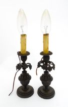 A pair of cast table lamps of candlestick form with floral and fluted decoration. Approx. 12"