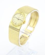 A ladies 18ct gold Omega wristwatch with 18ct gold case and strap. Watch case approx. 3/4" wide