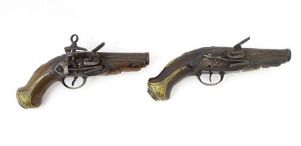 Militaria: a pair of 18thC continental miquelet flintlock belt pistols, each having 4 1/8" banded