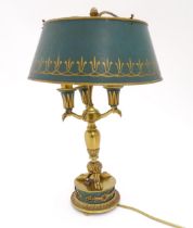 A brass table lamp with green detail formed as a three branch bouillotte style lamp. Approx. 19 1/2"