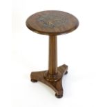 A Victorian mahogany and septarian nodule occasional table, the circular top raised on a canted