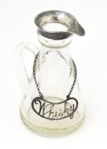 A glass whiskey water jug / noggin with silver mount hallmarked Birmingham 1909, maker Levi &