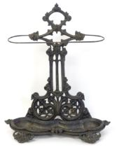 A late 19th / early 20thC cast iron stick stand with scrolling foliate detail. Impressed No.