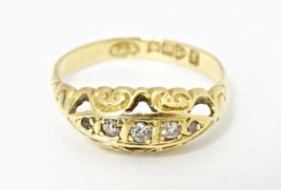 An 18ct gold ring set with diamonds, hallmarked Chester 1919. Ring size approx. K 1/2 Please