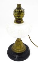 A table lamp formed from a converted Veritas oil lamp with white / milk glass reservoir. Approx. 15"