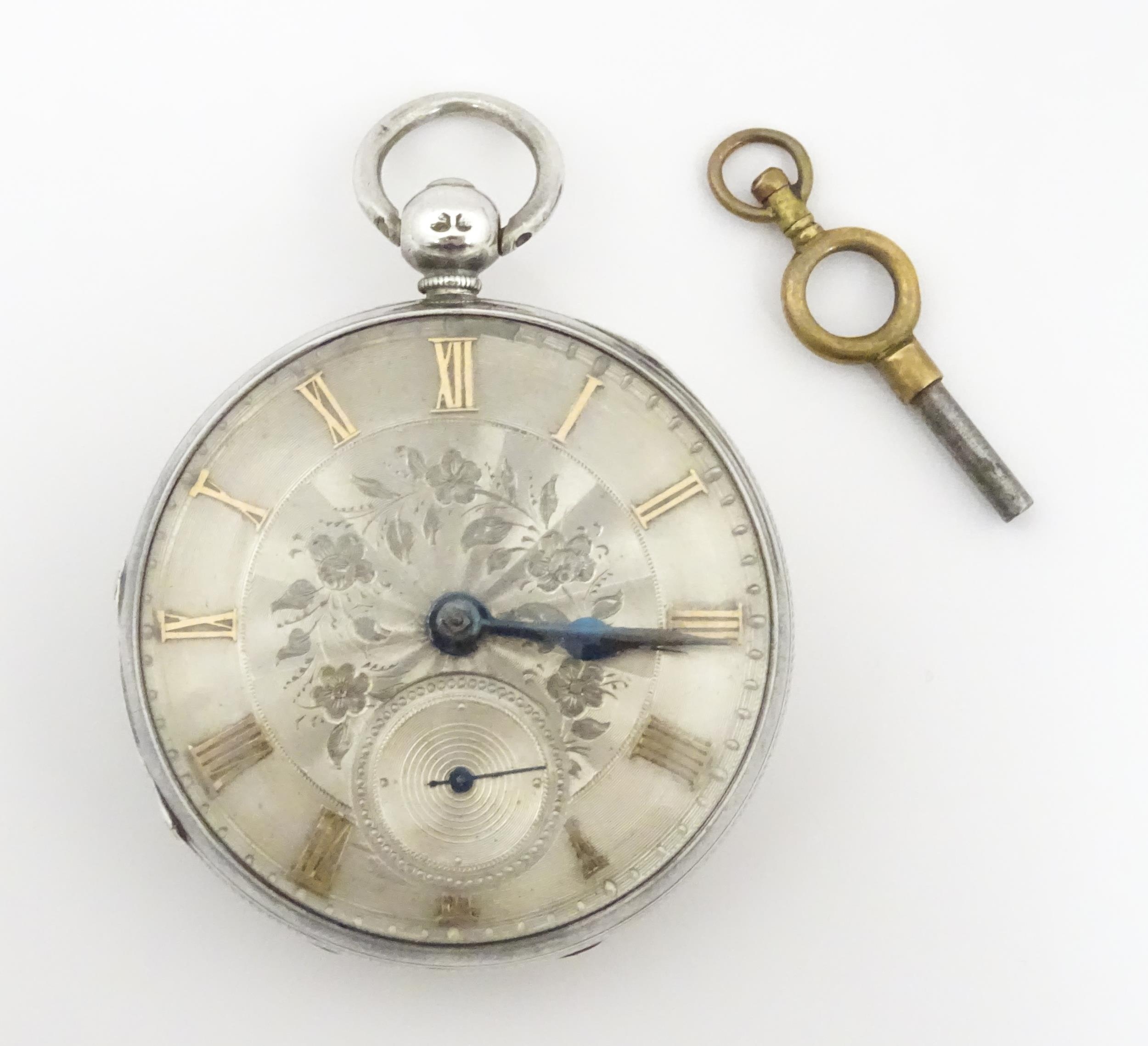 A Victorian silver cased pocket watch. The case hallmarked London 1847 maker William Carter. The key