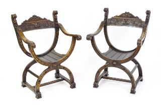 Two late 19thC / early 20thC Savonarola chairs, the uprights of scrolled form with carved mask
