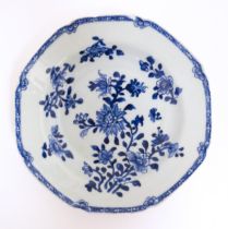 A Chinese blue and white dish with floral and foliate decoration. Approx. 8 3/4" wide Please