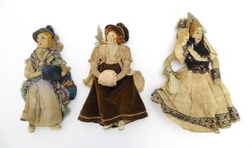 Three late 19th / early 20thC handmade cloth / rag dolls with embroidered features. Approx. 8"