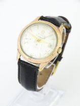 A gentlemans Titus Titomatic gold plated automatic wristwatch. Watch case approx. 1 3/8" wide Please