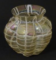An early 20thC Art Nouveau art glass vase of lobed form with trail and lustre detail. In the