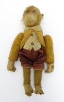 Toy: An early 20thC mechanical wind up tumbling / tumbler monkey toy with felt face, ears and
