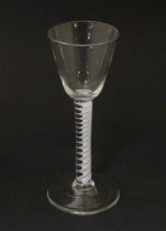 An 18thC wine glass with multi-ply corkscrew twist stem. Approx. 6" high Please Note - we do not
