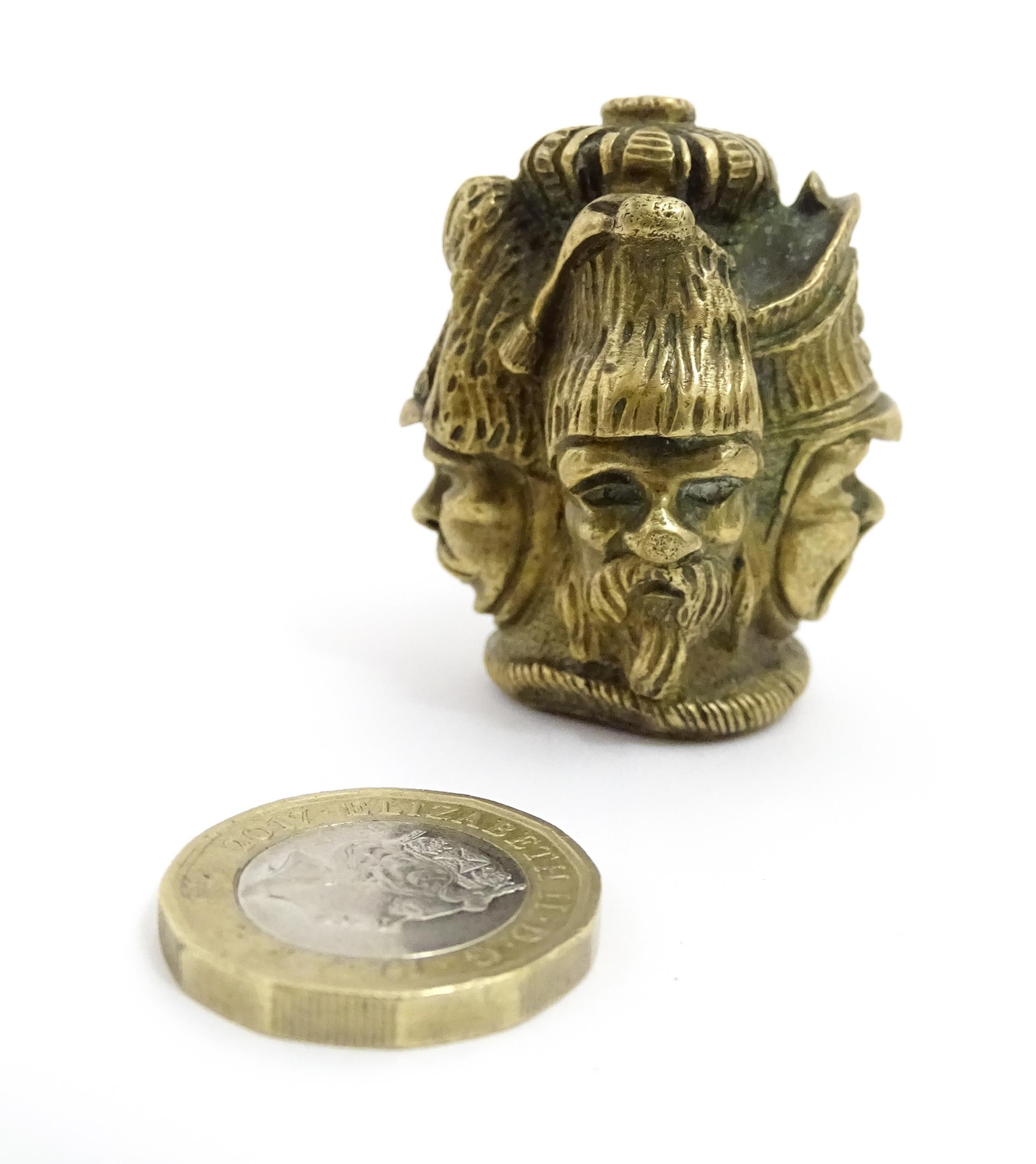 A 20thC cast brass cane top with multi face detail depicting four military figures. Approx. 1 3/4" - Image 3 of 7