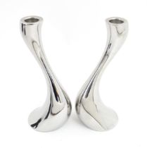 A pair of Scandinavian Georg Jensen cobra candlesticks. Marked under Georg Jensen Denmark. Approx. 7