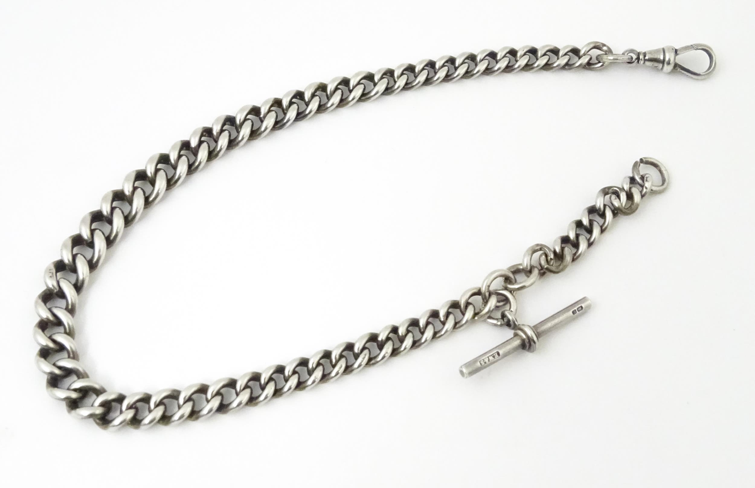 A silver graduated curb link pocket watch chain. Approx. 14 1/2" long Please Note - we do not make