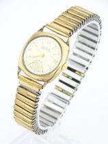 A 9ct gold cased manual wind wristwatch by Omer with subsidiary seconds dial, the 9ct gold case