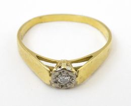 An 18ct gold ring set with diamond solitaire. Ring size approx. K Please Note - we do not make