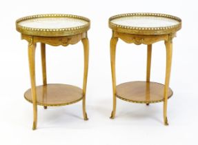 A pair of mid 20thC marble topped tables surmounted by pierced gilt upstands. The table each