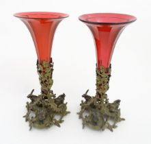 Two epergne / centrepiece vases the ruby glass flutes supported by gilt metal bases decorated with