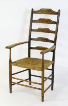 A late 19thC Arts & Crafts Cotswold School Clissett ladderback armchair raised on turned tapering