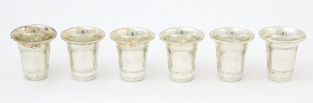 Judaica Interest: Six silver kiddish / tot cups hallmarked London 1921 / 1922, maker M Salkind.