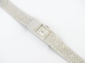 A ladies 9ct white gold wristwatch the dial signed Bueche-Girod, the gold case and strap by London