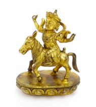 An Oriental cast brass figure modelled as a deity on horseback. Approx. 8 3/4" high Please Note - we