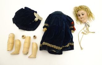 Toy: An Armand Marseille bisque doll head with painted features. Together with composite body and