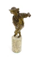 A 20thC cast figure modelled as a young man holding a birds nest. Raised on a cylindrical marble