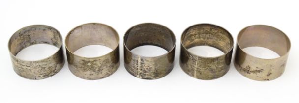 Five assorted silver napkin rings hallmarked London 1943, 1960 & 1961, maker Robert Pringle &