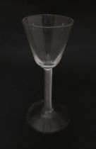 A 19thC pedestal cordial glass with air twist stem. Approx 6 1/2" high Please Note - we do not