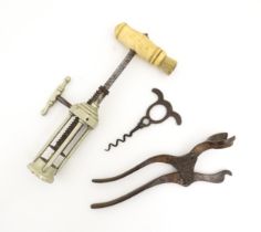 A 19thC corkscrew with rack and pinion mechanism and a turned bone handle with brush to one end.