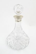 A lead crystal decanter with silver mount hallmarked Birmingham 1978, maker Mappin & Webb. Approx.