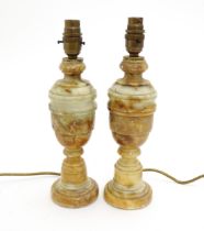 A pair of carved alabaster table lamps. Approx. 12 1/2" high (2) Please Note - we do not make
