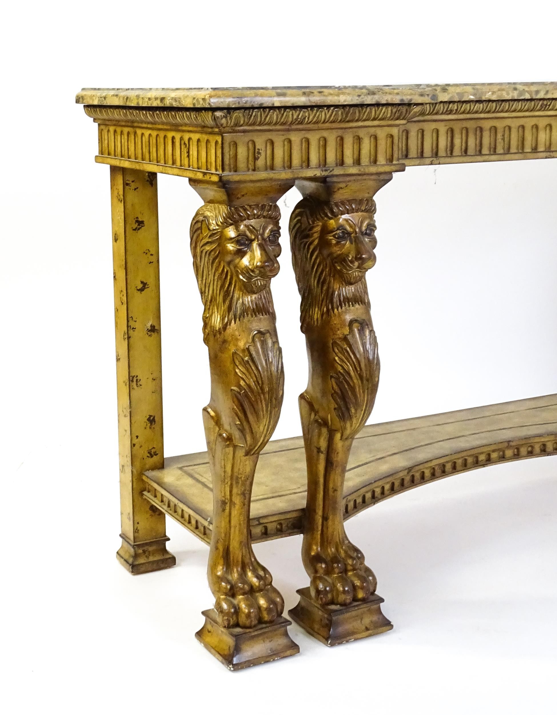 A late 20thC marble and wooden topped inverted break front console table with two pairs of lion - Image 2 of 10
