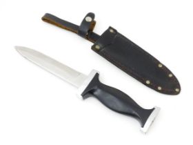 Militaria : a post-WWII German dagger/hunting knife and sheath by Ern, Solingen. The Bakelite grip