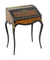 A 19thC boulle work writing desk, surmounted by a pierced brass upstand and having boulle work