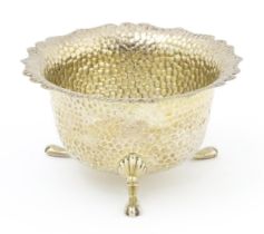 A silver bowl with hammered decoration hallmarked 1905, maker Marples & Co. Approx. 2" high x 3 1/2"