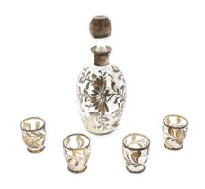 A Schnapps decanter together with four glasses with lustre detail. The decanter 9" high Please