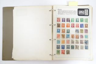 A stamp album containing Victorian and early to mid 20thC British, colonial and worldwide postage